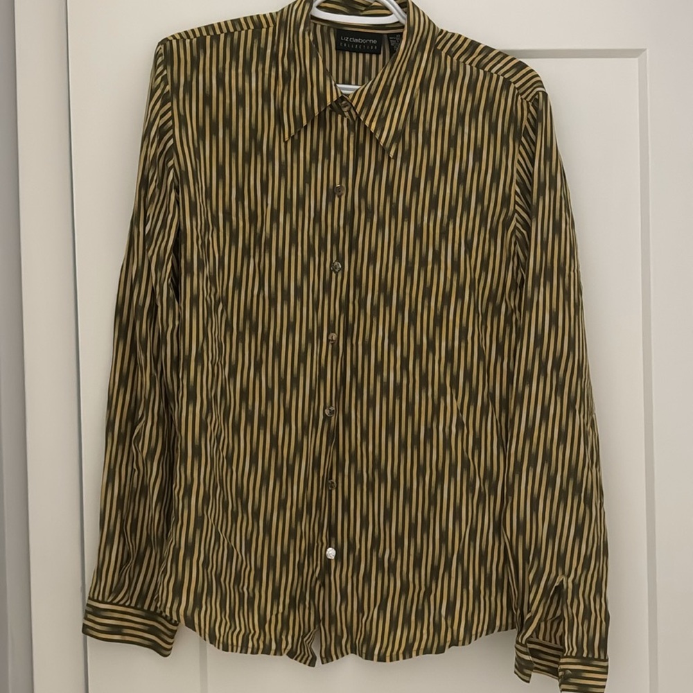 100% Silk 
Dry Cleaned Only
Has grommets so you can cinch the shoulder